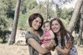 Portrait of happy lesbians mothers with a baby. Homosexual fami Royalty Free Stock Photo