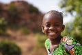 Portrait Of a Happy Little African Girl In An Natural Environment