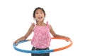 Portrait of happy little Asian child girl playing hulahoop on is Royalty Free Stock Photo