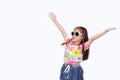 Portrait of happy little Asian kid girl stretch arms wide open up wearing a floral pattern summer dress and sunglasses isolated on Royalty Free Stock Photo