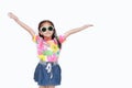 Portrait of happy little Asian kid girl stretch arms wide open up wearing a floral pattern summer dress and sunglasses isolated on Royalty Free Stock Photo