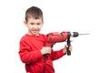 Portrait of happy little boy holding electric drill. A little construction worker. Isolated on white Royalty Free Stock Photo