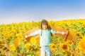 Happy little boy playing pilot in sunflower field Royalty Free Stock Photo