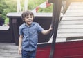 Portrait of happy little boy playing in the playground in the park, Kid with smiling face enjoy playing outdoor, Active child Royalty Free Stock Photo