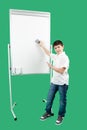 Portrait of happy little boy showing white blank board Royalty Free Stock Photo