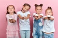 Portrait of happy little children holding cupcakes Royalty Free Stock Photo