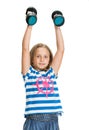 Portrait of happy little girl with dumbbells Royalty Free Stock Photo