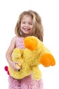 Portrait of a happy little girl holding a yellow plush toy