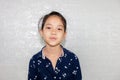 Portrait of Happy little girl kid smiling and looking at camera with blurred background