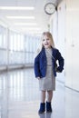 Portrait of happy little girl wearing dress and blue jacket
