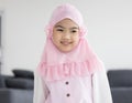 Portrait of happy little muslim girls child with hijab dress smi