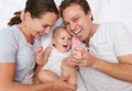 Portrait of a happy loving family playing with baby Royalty Free Stock Photo