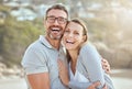 Portrait of happy and loving mature caucasian couple enjoying a romantic date at the beach together on a sunny day Royalty Free Stock Photo