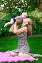 Portrait of happy loving mother and her baby outdoors Royalty Free Stock Photo