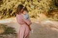 Portrait of happy loving mother and her baby son outdoors Royalty Free Stock Photo