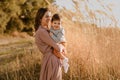 Portrait of happy loving mother and her baby son outdoors Royalty Free Stock Photo