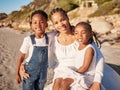 Portrait of a happy loving young african american mother at the beach with her two children. Little girl and boy Royalty Free Stock Photo