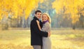 Portrait of happy loving young couple together in autumn park on warm sunny day Royalty Free Stock Photo