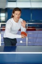 Portrait of happy male athlete playing table tennis at training sport club Royalty Free Stock Photo