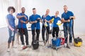 Portrait Of Happy Male And Female Janitors Royalty Free Stock Photo