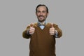 Portrait of happy man gesturing thumbs up. Royalty Free Stock Photo