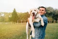 Portrait of happy man holding his friend dog Royalty Free Stock Photo