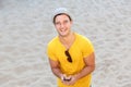 Happy man laughing with mobile phone at the beach Royalty Free Stock Photo