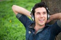 Portrait of a happy man listening to music outdoors