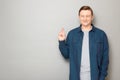 Portrait of happy man raising crossed fingers and hoping for victory Royalty Free Stock Photo