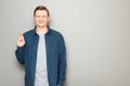 Portrait of happy man raising crossed fingers and hoping for victory Royalty Free Stock Photo