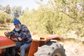 Portrait of happy man sitting in tractor Royalty Free Stock Photo
