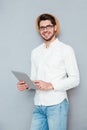 Portrait of a happy man using tablet computer Royalty Free Stock Photo