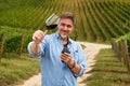 Portrait of happy man in vineyard with glass of wine Royalty Free Stock Photo