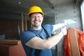 Cheerful builder looking at camera