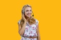 Portrait of happy mature blonde woman wearing headset. Royalty Free Stock Photo