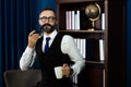 Portrait of happy mature businessman bearded wearing glasses and suite on dark background