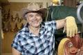 Portrait of a happy mature cowboy in feed store