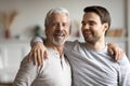 Portrait of happy mature father hug grownup son Royalty Free Stock Photo