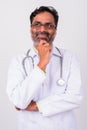 Portrait of happy mature handsome bearded Indian man doctor Royalty Free Stock Photo