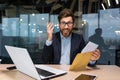 Portrait of happy mature investor businessman in office, man looking at camera and shocked happy and smiling, boss