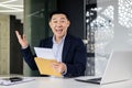 Portrait of happy mature investor businessman in office, man looking at camera and shocked happy and smiling, boss