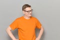 Portrait of happy mature man with glasses, wearing orange T-shirt Royalty Free Stock Photo