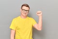 Portrait of happy mature man raising clenched fist up and smiling Royalty Free Stock Photo