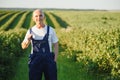 Portrait happy mature older man is smiling. Old senior farmer with white beard. Elderly man standing and looking at camera at Royalty Free Stock Photo