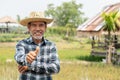 Portrait happy mature older man is smiling. Old senior farmer with white beard thumb up feeling confident. Royalty Free Stock Photo