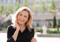 Portrait of happy mature woman on street Royalty Free Stock Photo