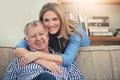 So glad I get to call him Dad. Portrait of a happy mature woman hugging her elderly father at home. Royalty Free Stock Photo