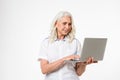 Portrait of a happy mature woman using laptop Royalty Free Stock Photo