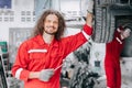 portrait happy mechanic garage staff worker enjoy car service. tire replace in garage auto workshop Royalty Free Stock Photo