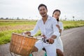 happy man and woman cycling outdoor smiling to camera
